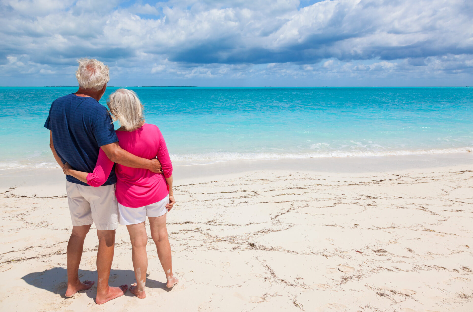 Mature Caucasian couple in tropical luxury travel resort